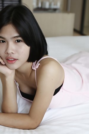 21yo busty Thai shemale strips for the camera to tease her white cock date